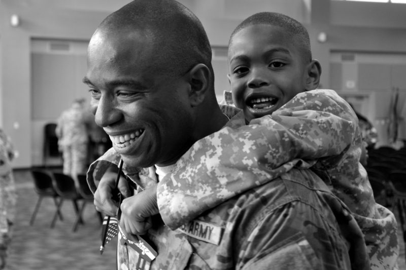 Military father smiling with his son