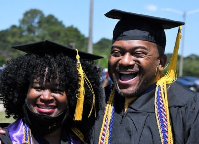 040 Two Graduates Beam After The Ceremony