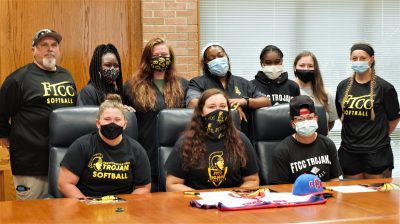 Group shot of the Fayetteville Tech softball team in a boardroom.