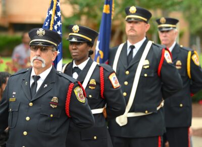 Members of the Cumberland County Emergency Services Honor Guard walk in a line to post the colors.