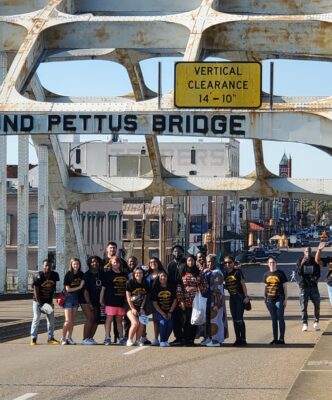 College students stand on the Edmund Pettus Bridge in Selma, Alabama.
