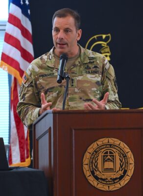 Lt. Gen. Christopher Donahue, commander of the 18th Airborne Corps and Fort Liberty, speaks at the podium.