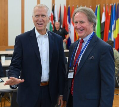 Senator Thom Tillis and FTCC President Mark Sorrells stand next to each other laughing.