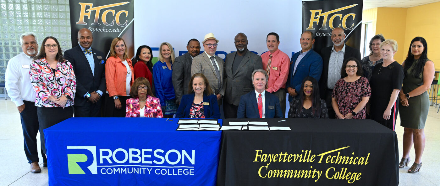 FTCC and RCC administrators and team members pose after the signing of a partnership agreement.