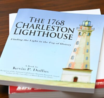 The cover of "The 1768 Charleston Lighthouse: Finding the Light in the Fog of History" features a color rendering created by FTCC instructor Glenn Massie. [Photo by Brad Losh]