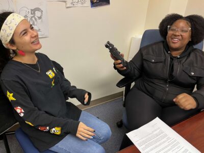 Volunteers Aria and Nasariyah share and record stories for the storytelling event Tale