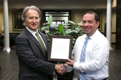 FTCC President Dr. Mark Sorrells congratulates Dr. Vincent Castano, Dean of Institutional Effectiveness