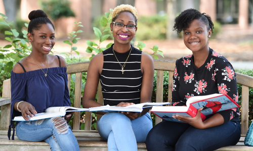 Three FTCC Students Sitting on a Bench