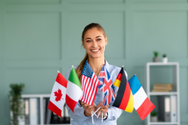 Female Student Holding Various Country Flags