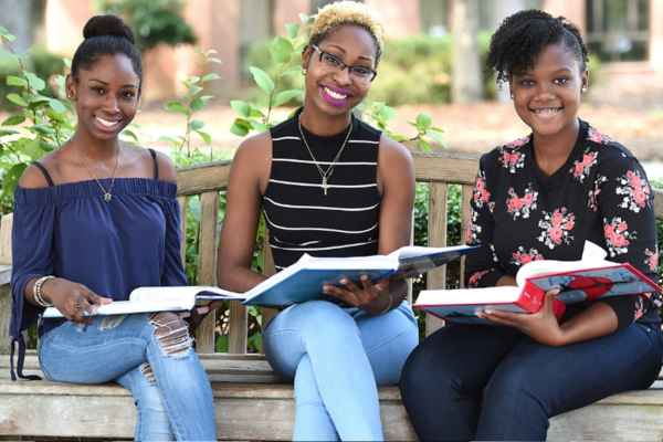 Three Ftcc Students Sitting On Bench 