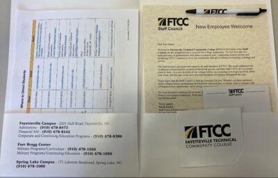 Overhead photo of FTCC welcome materials laid out on a table.