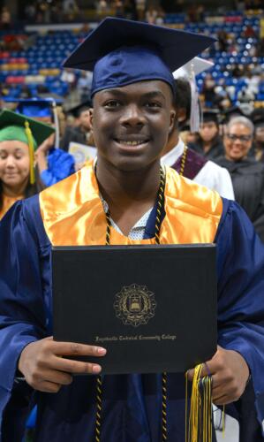 A-High-School-Connections-student-smiles-after-receiving-his-FTCC-diploma