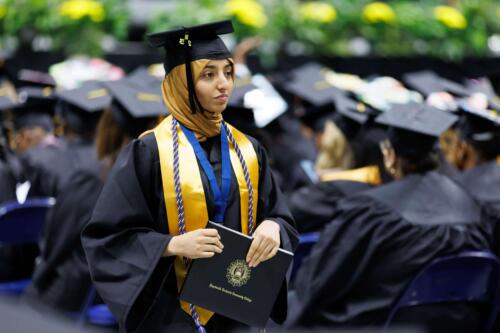 A-graduate-gazes-solemnly-in-the-distance