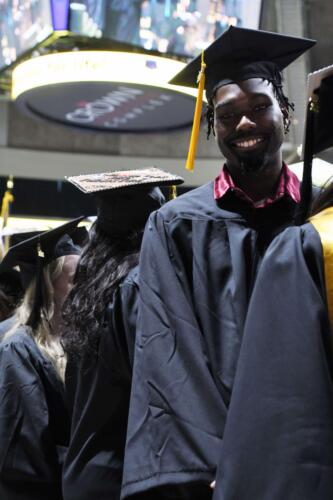 A-graduate-smiles-as-he-waits-in-line-at-the-Crown