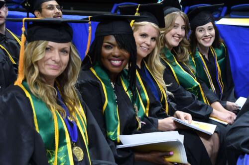 A-group-of-graduates-from-FTCCs-horticulture-program-smile-from-their-seats-in-the-Crown