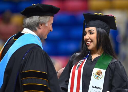 Dr.-Sorrells-congratulates-a-smiling-graduate