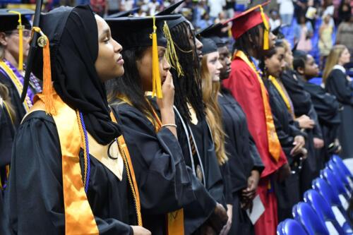 Graduates-stand-and-look-at-the-stage