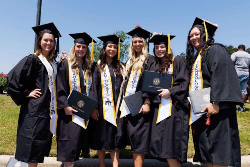 Six-radiologic-technology-graduates-pose-together-outside-the-Expo-Center