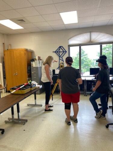 Students learn about FTCC Civil Engineering Pathway by engaging in hands-on activities. Students learning about the tools that help measure distances used in the Civil Engineering program and real-world positions. 