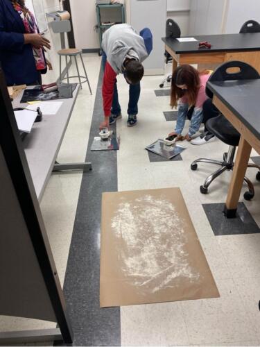 Students engaging in learning how to pull footprints from crime scenes in the FTCC Criminal Justice Technology – Forensic Science Lab.
