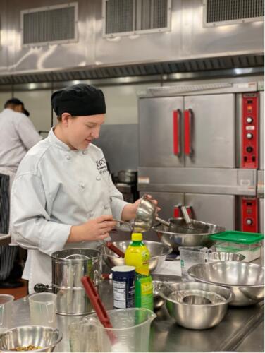 CPHS student mixing ingredients during culinary class in the FTCC Culinary student kitchen.