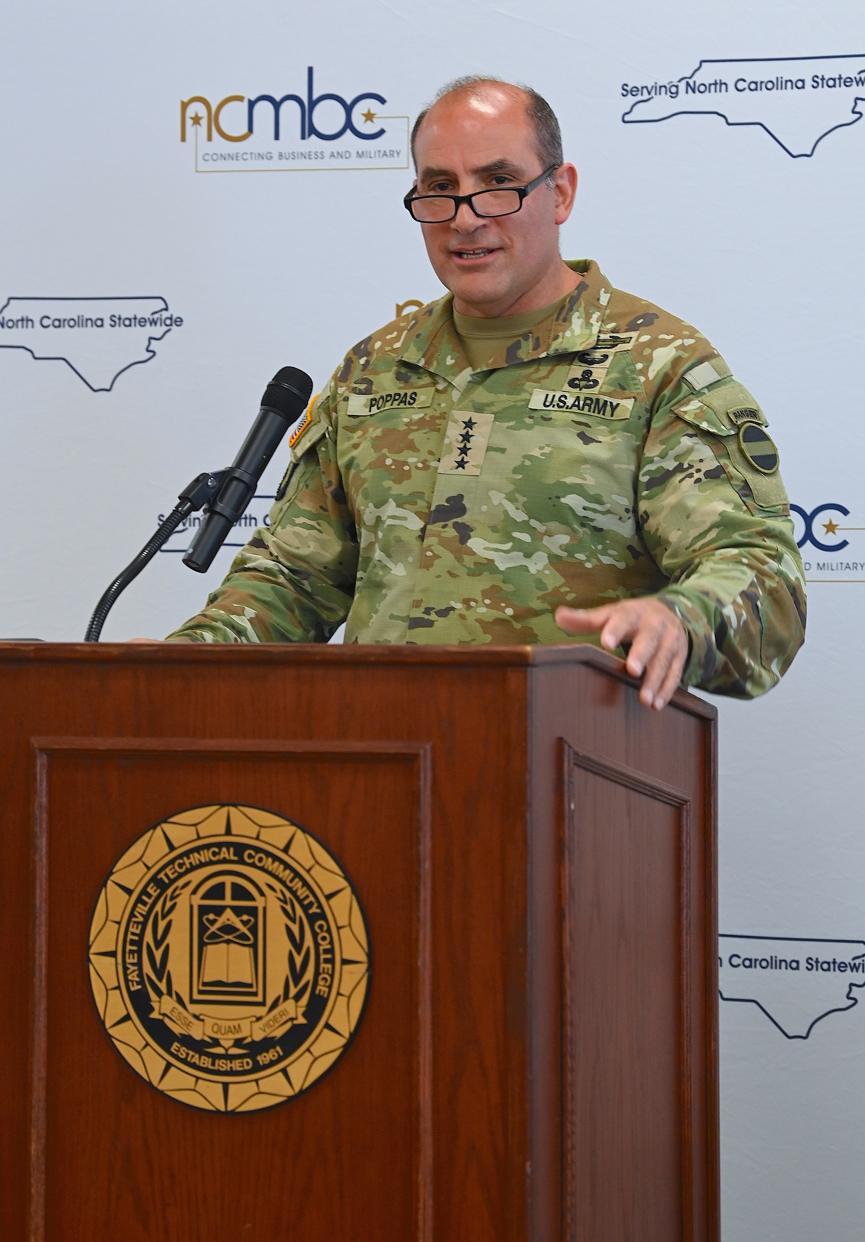 FORSCOM Commanding Gen. Andrew Poppas speaks at the podium during the Defense Technology Symposium.