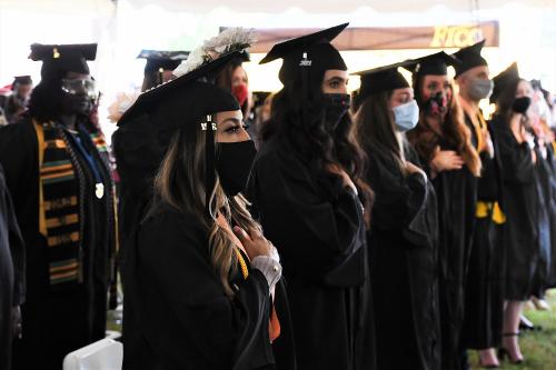 013 - Graduates listen to the National Anthem