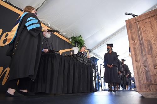 025 - Dean Harmon prepares to congratulate graduates in Tent B