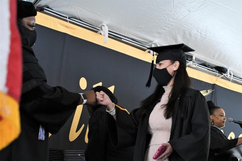 030 - A dean congratulates a graduate