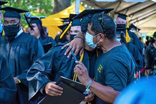 037 - A graduate gets a congratulatory hug