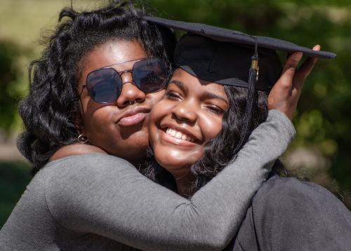 049 - A graduate gets a congratulatory hug