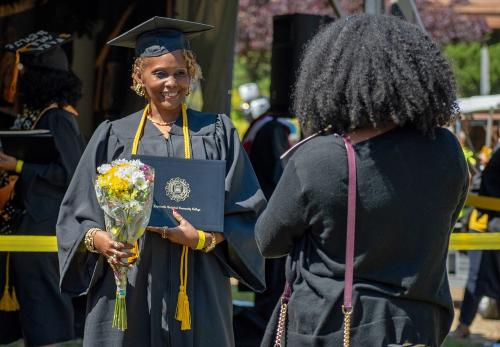 051 - A graduate poses for a photo