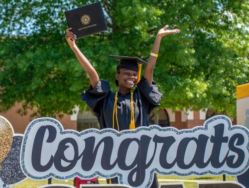 057 - A happy graduate exults