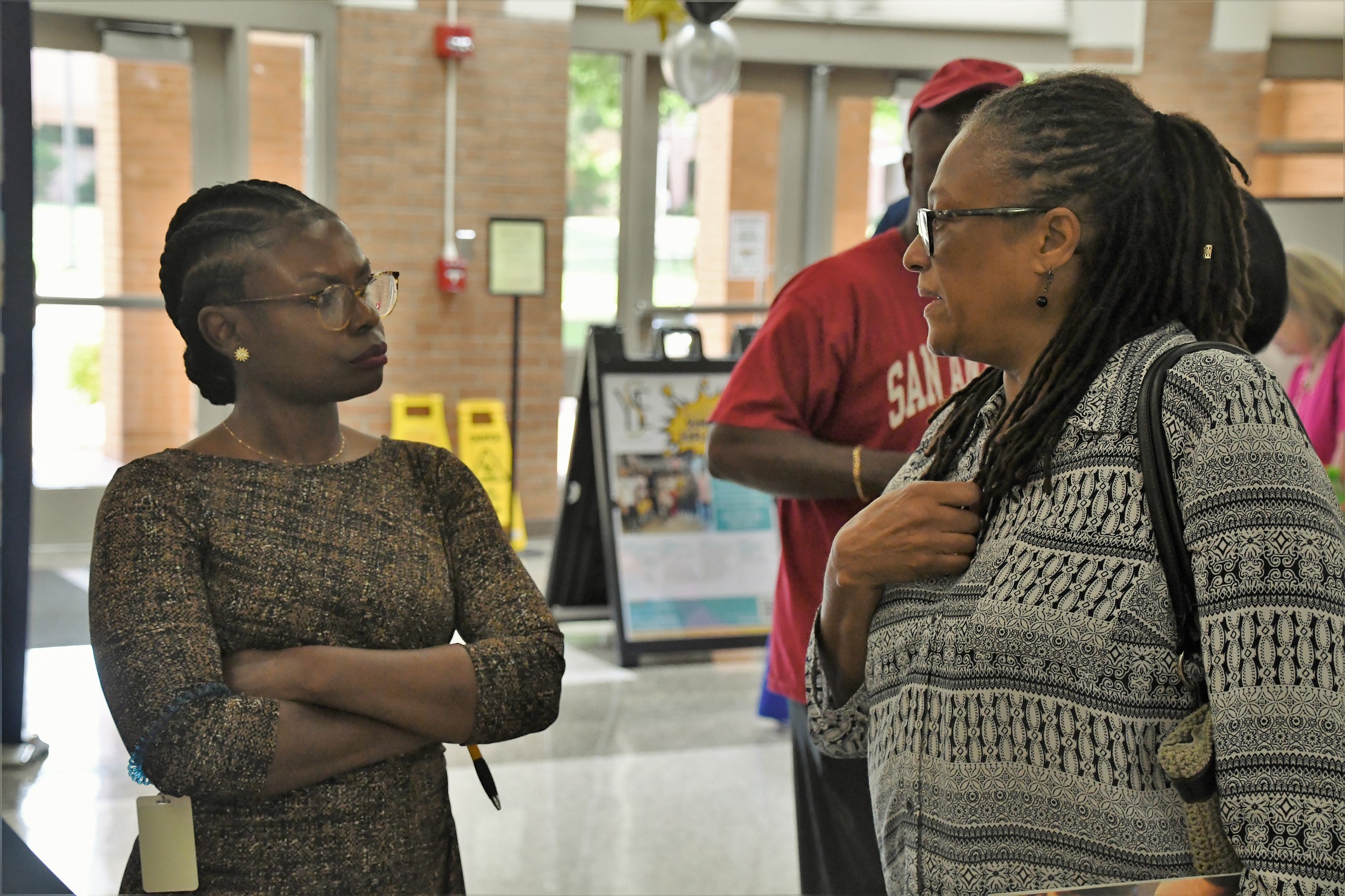 A job seeker and an employer talk at the Expo.