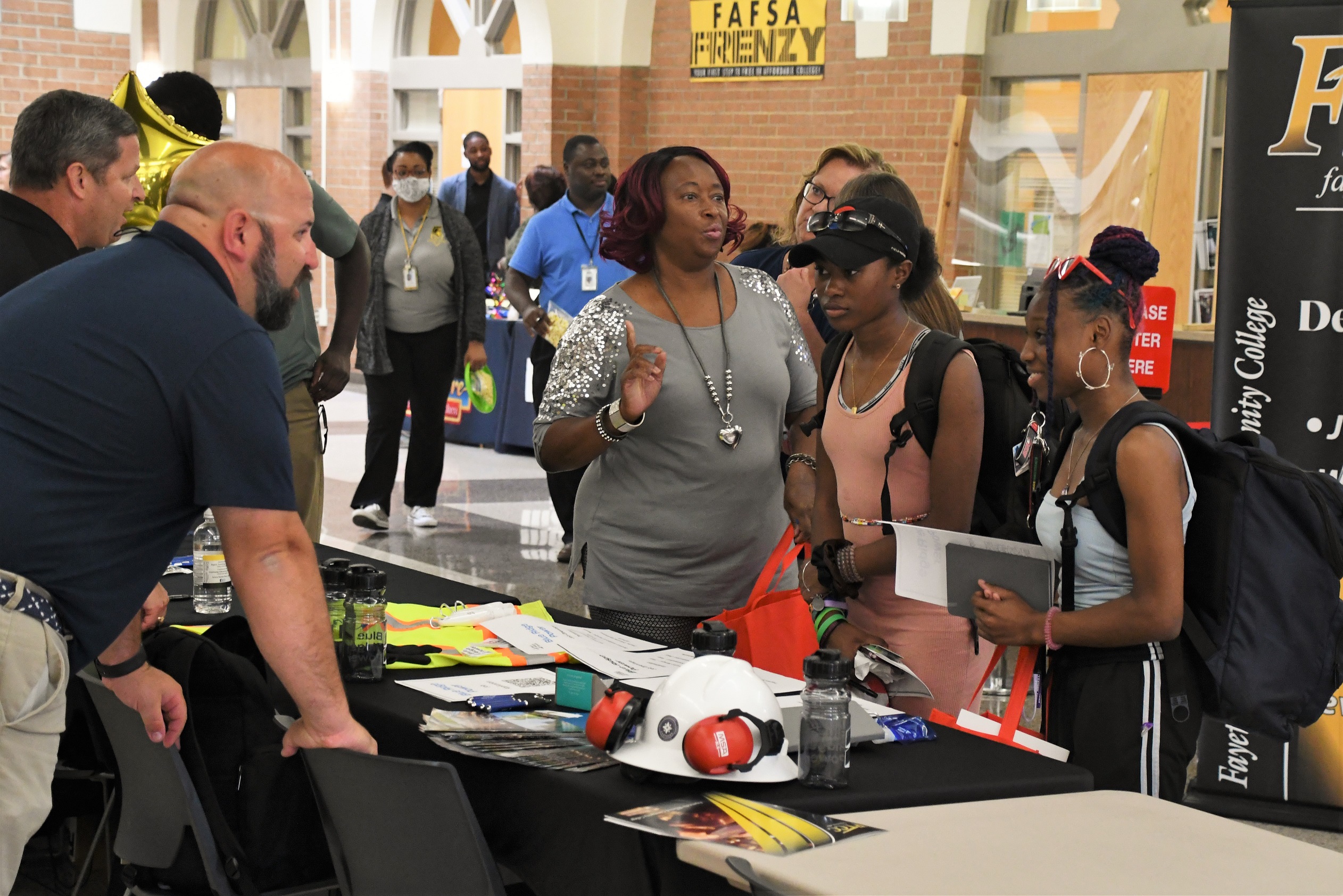 Students talk with an employer at the Expo.