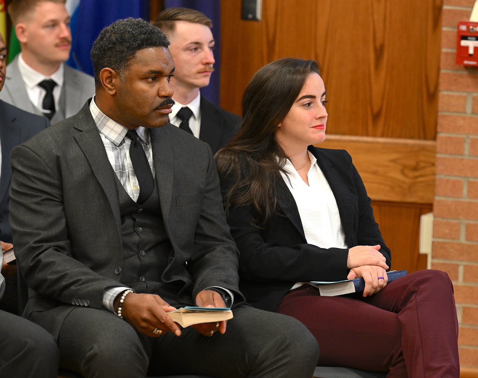 A close-up photo of the group of seated graduates.