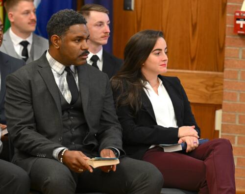 A close-up photo of the group of seated graduates.