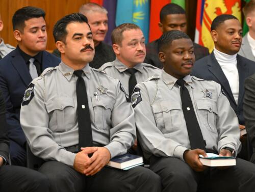 A close-up photo of the group of seated graduates.