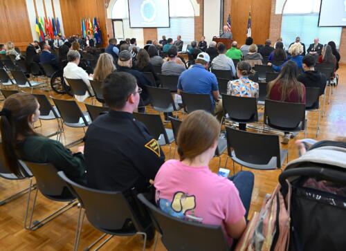A wide photo taken from behind the crowd at the BLET graduation.