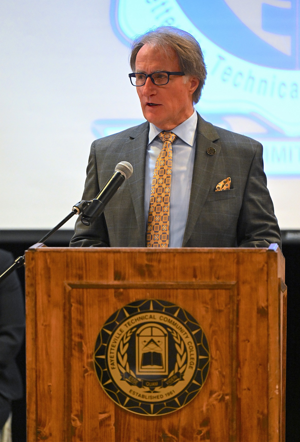 FTCC President Dr. Mark Sorrells speaks at the podium.