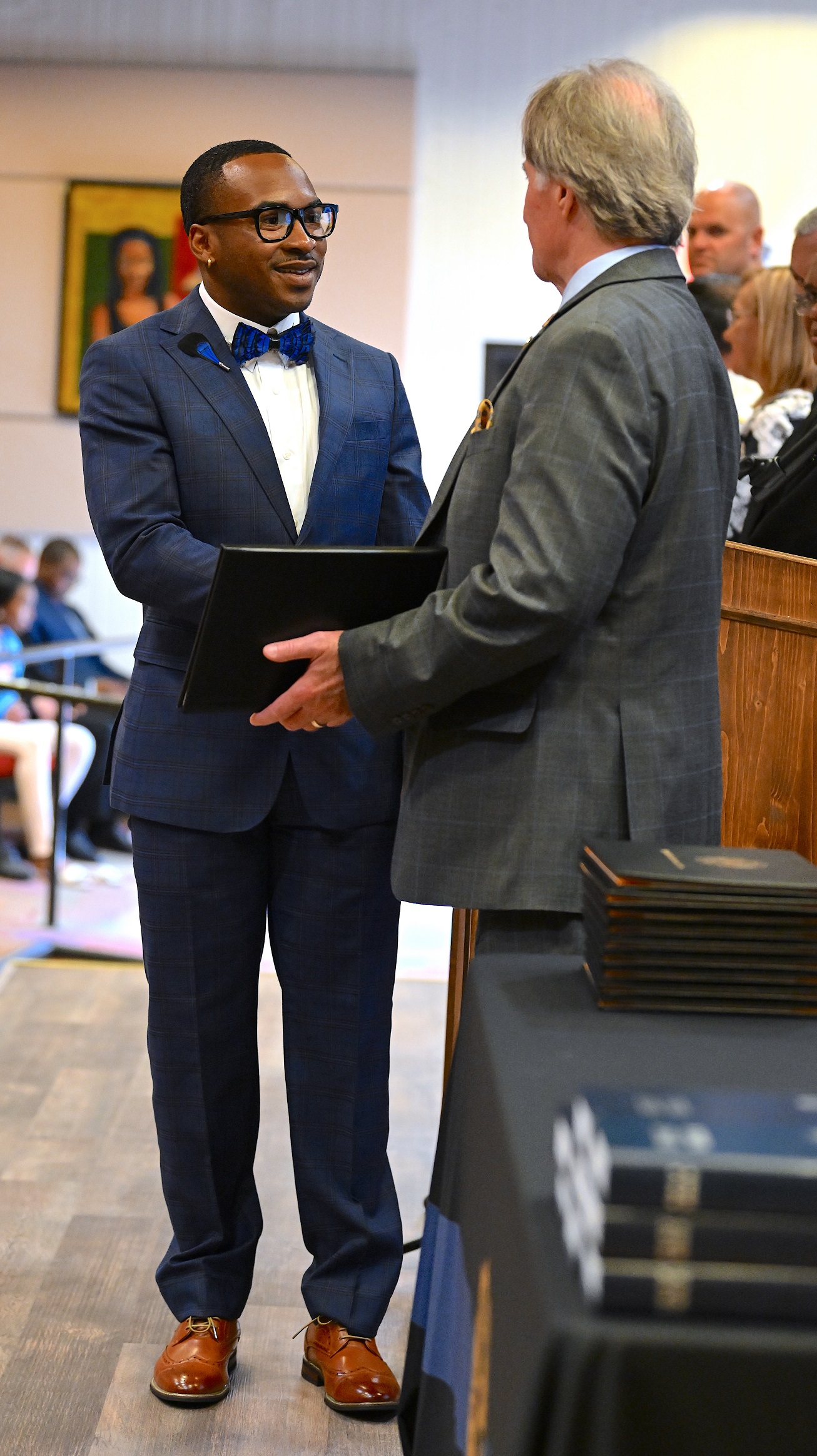 A BLET graduate shakes hands with Dr. Sorrells before receiving his certificate.