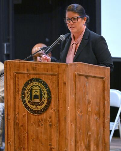 Yovana Vest speaks at the podium.