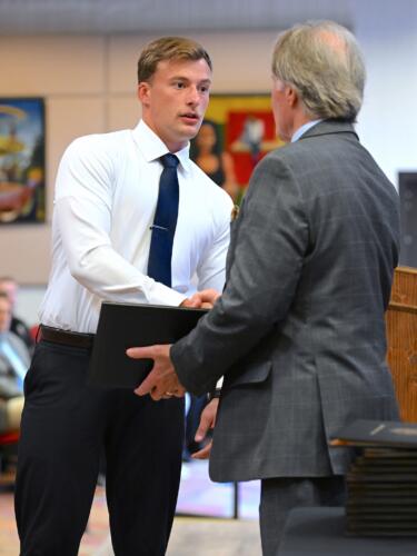 A BLET graduate shakes hands with Dr. Sorrells before receiving his certificate.