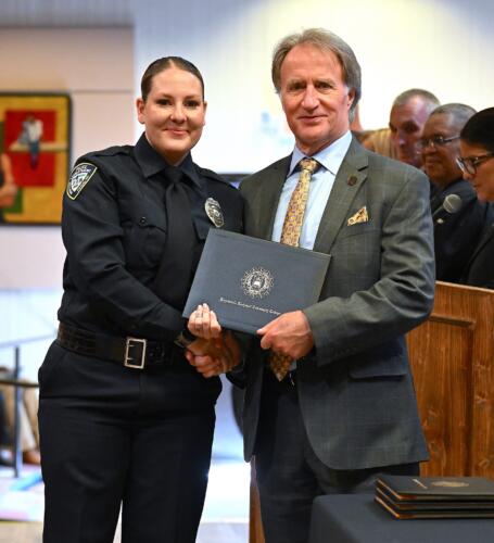 A BLET graduate poses with Dr. Sorrells after receiving her certificate.