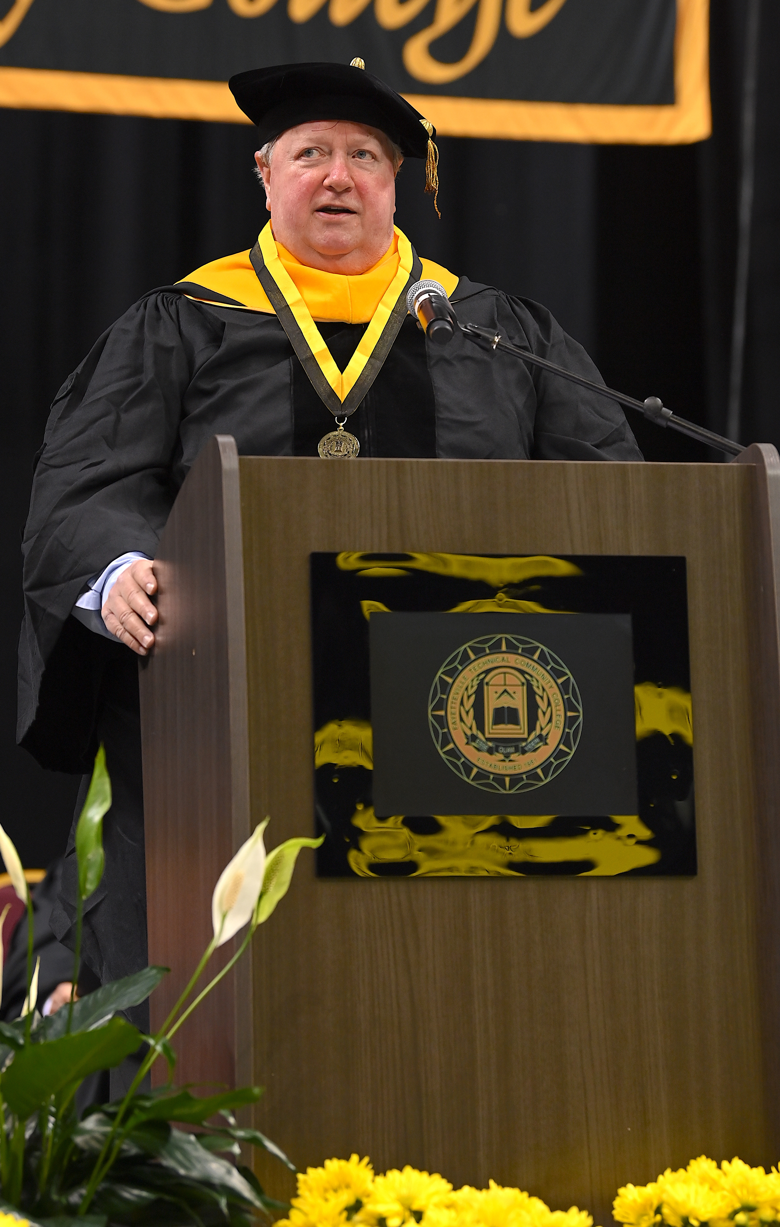 David Williford speaks at the podium.