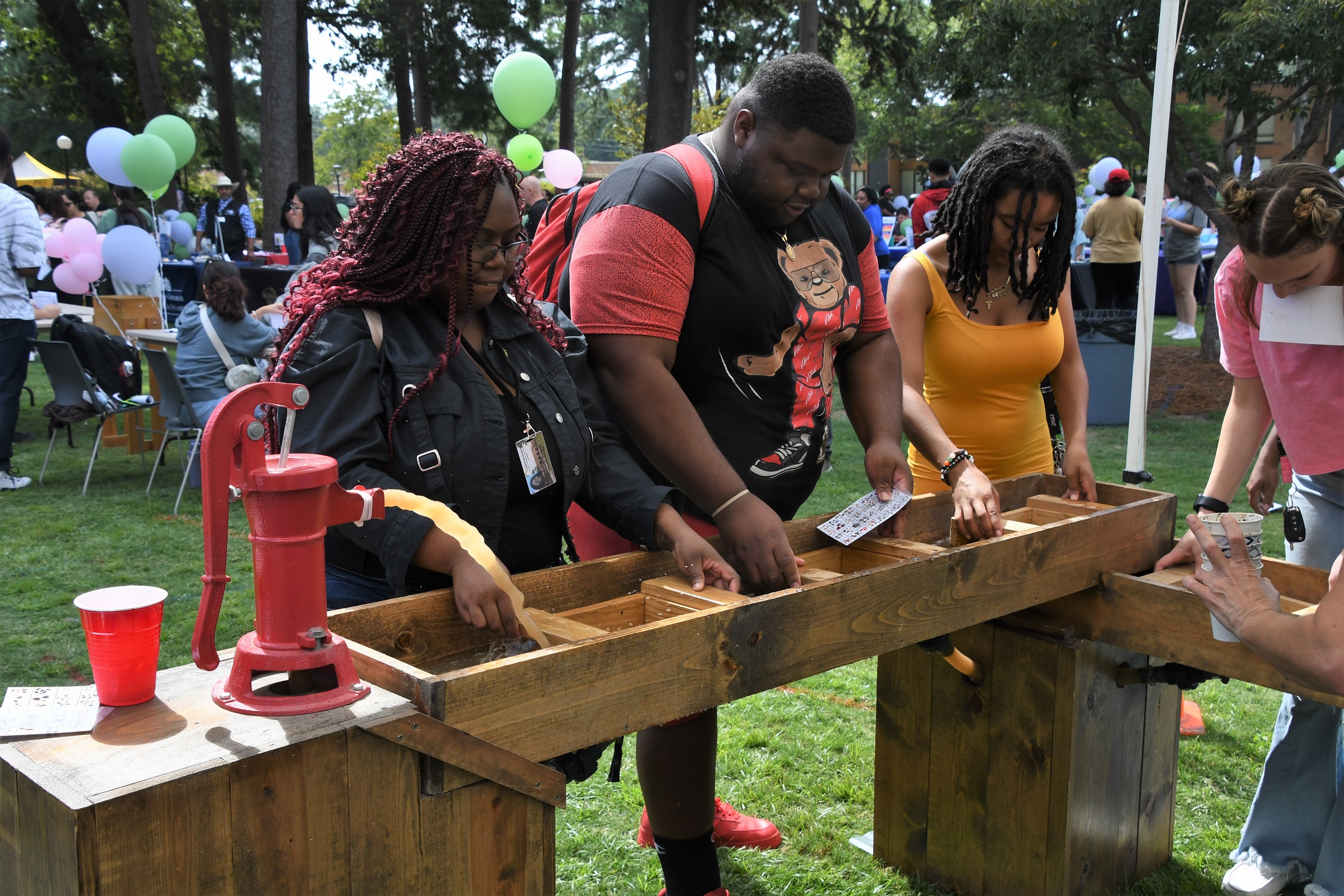 Students pan for gemstones.