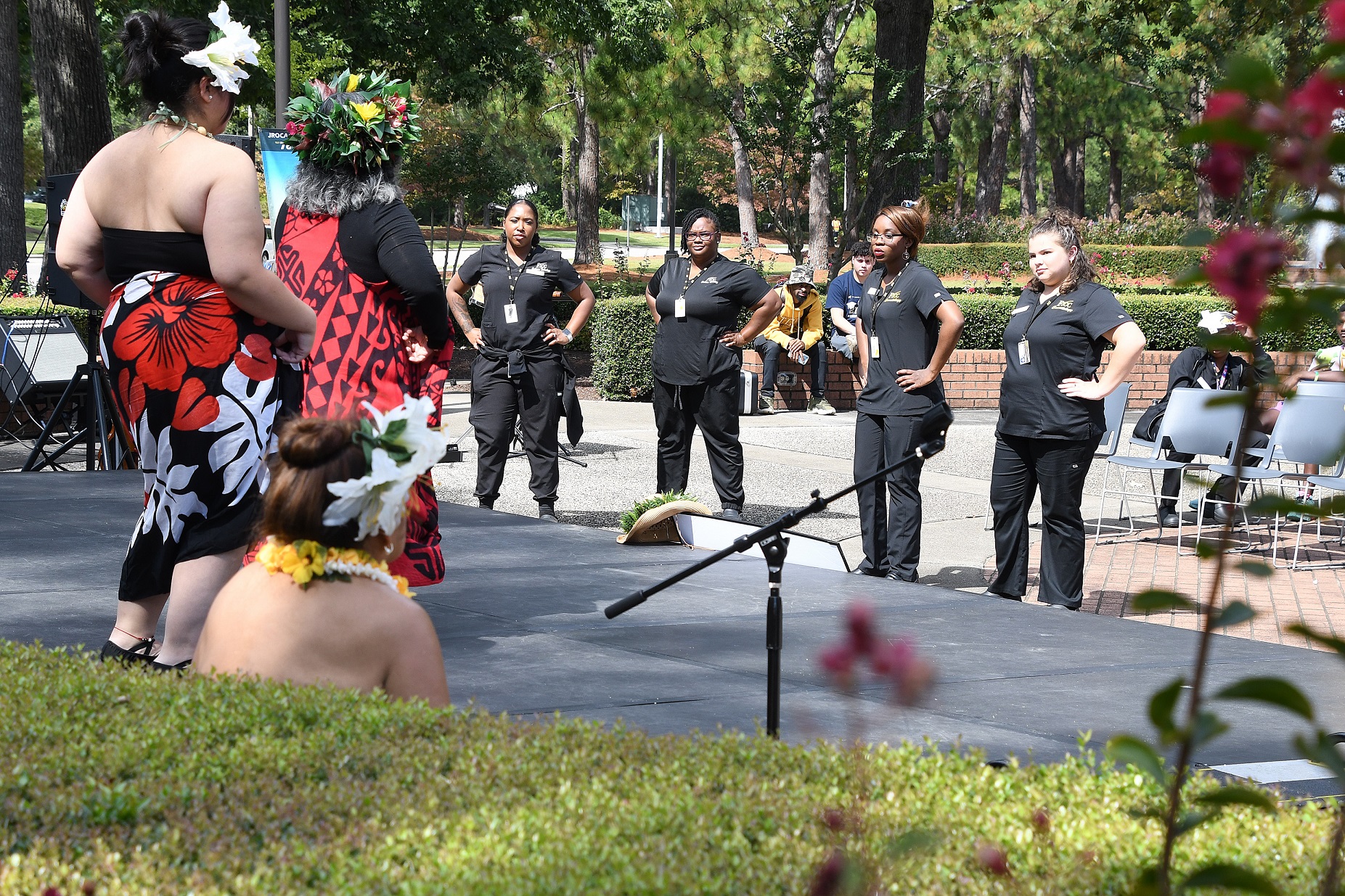 A group of Cosmetology students participate in a hula dance.