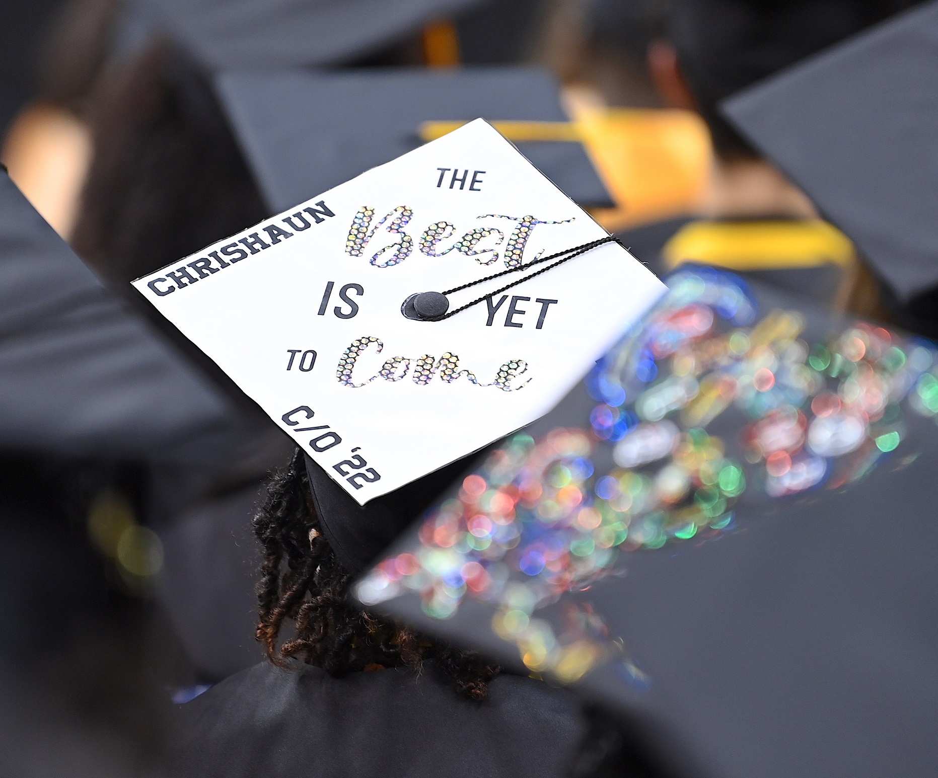 A graduation cap that says "The Best is Yet to Come"