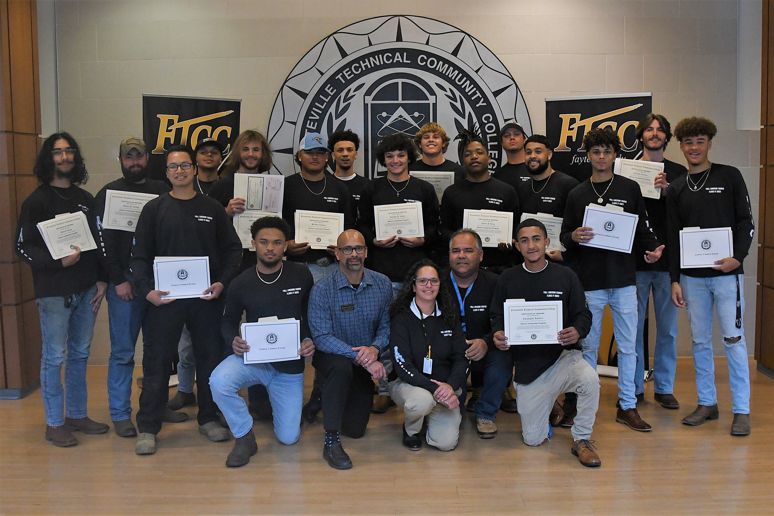 Graduates of FTCC's Electric Lineworker Basic Training course pose with their certificates.