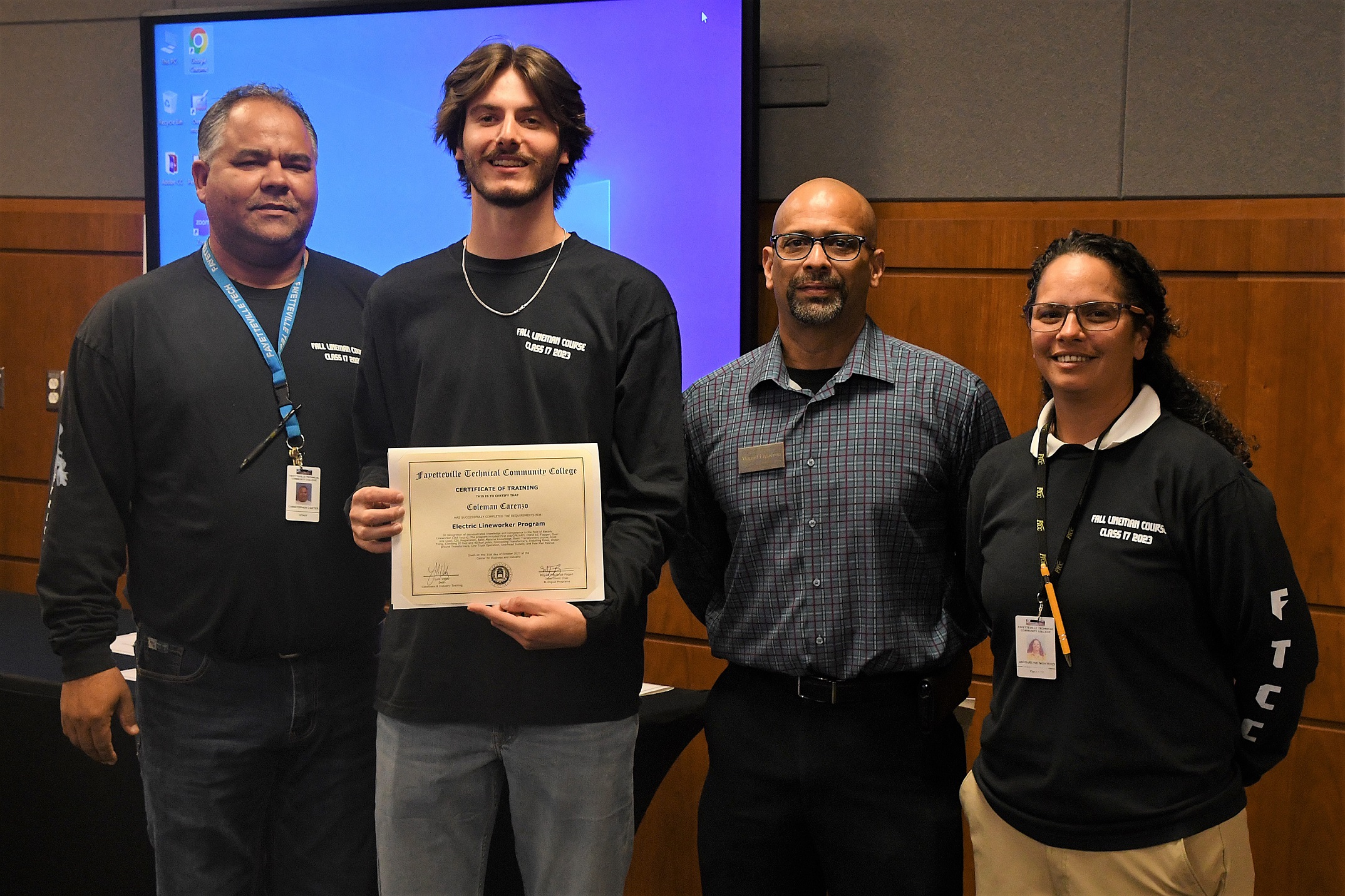 A graduate of FTCC's Electric Lineworker Basic Training course poses after receiving his certificate.